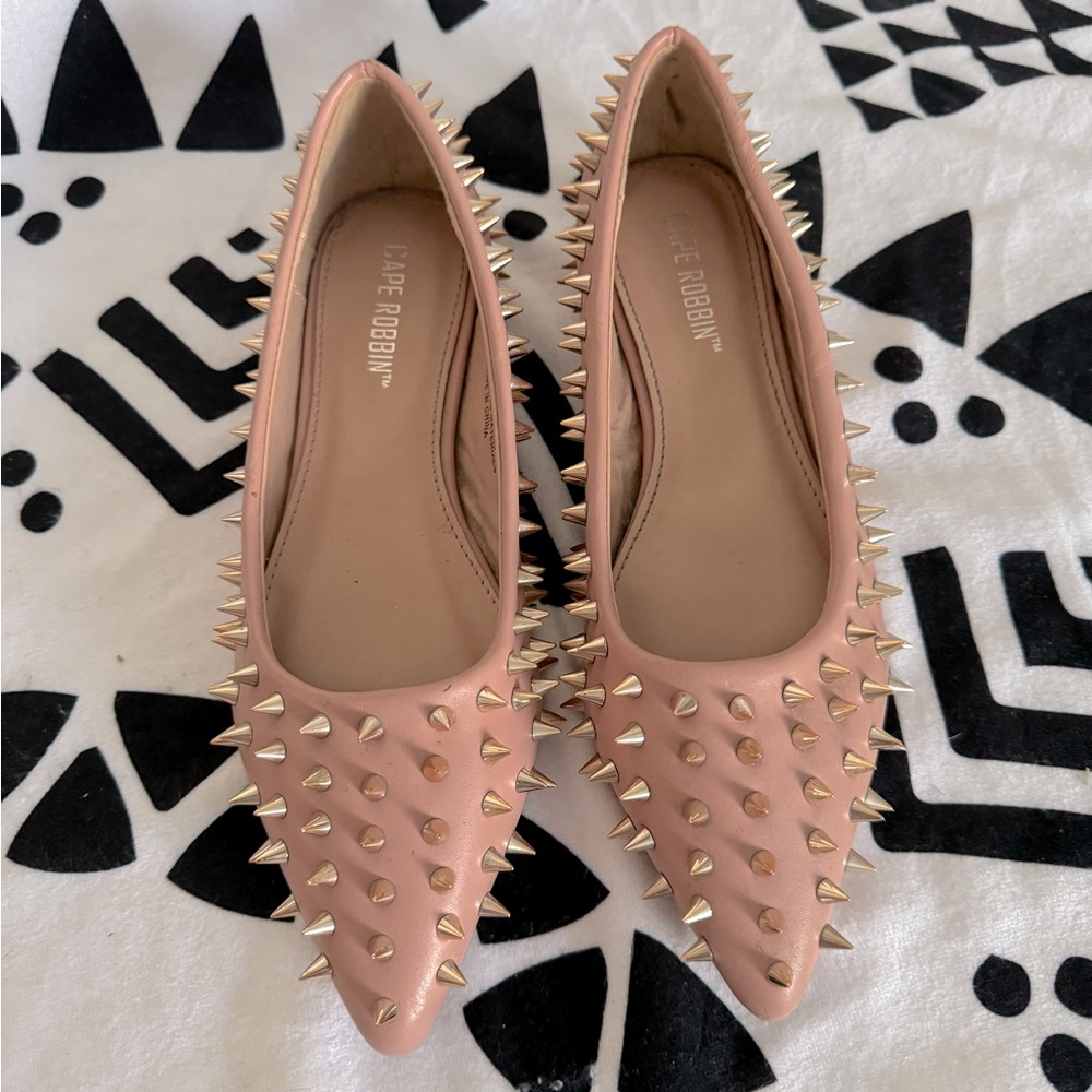 Pink flats with gold spikes